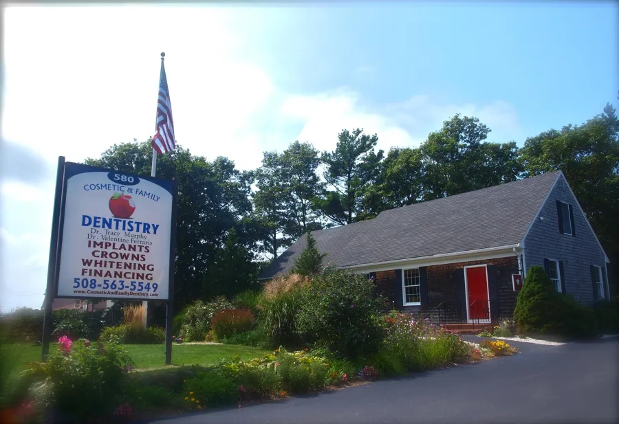 The Cosmetic & Family Dentistry office at 580 MacArthur Boulevard with its sign out front