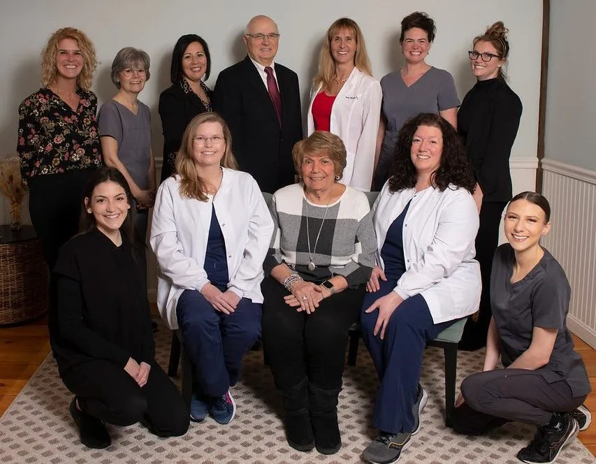 The Cosmetic & Family Dentistry team gathered together in the office